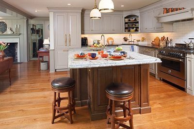 Kitchen With Wide Plank Flooring And Marble Countertop