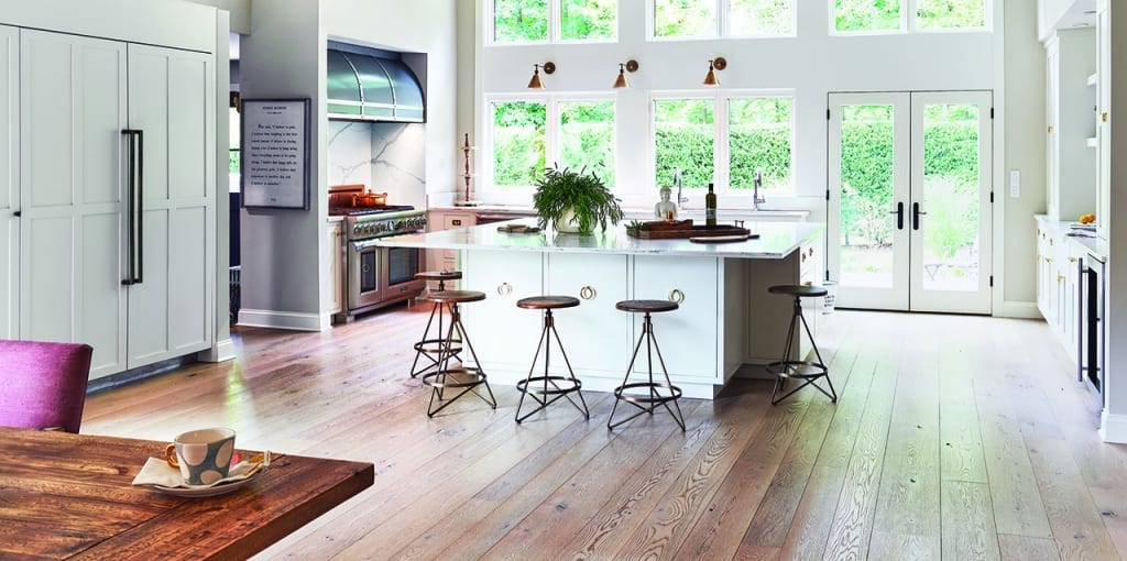 Kitchen with White Island and Brown rustic Floors