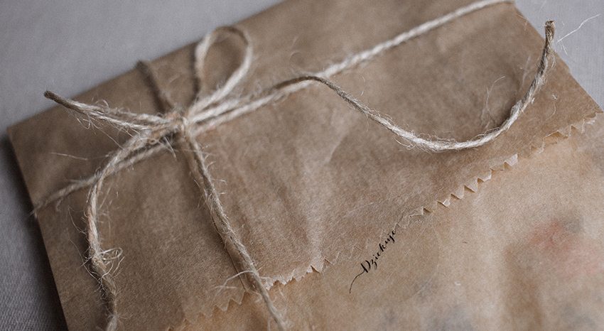 Brown paper package wrapped in string