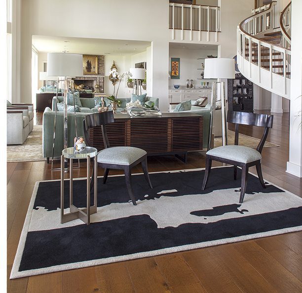 open living space with black and white wool rug
