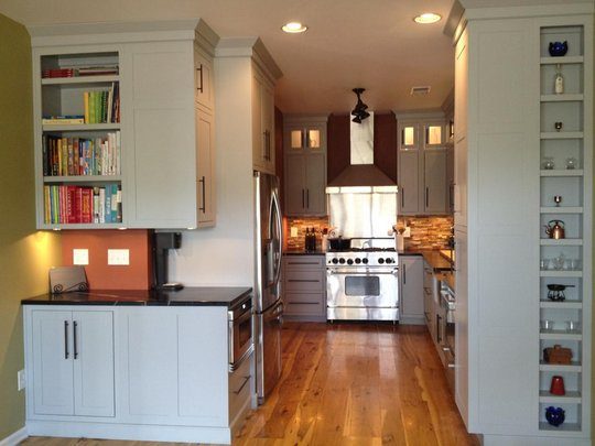 small kitchen with wide plank floors