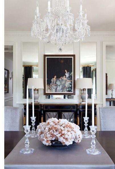 a modern dining room with crystal and floral accents