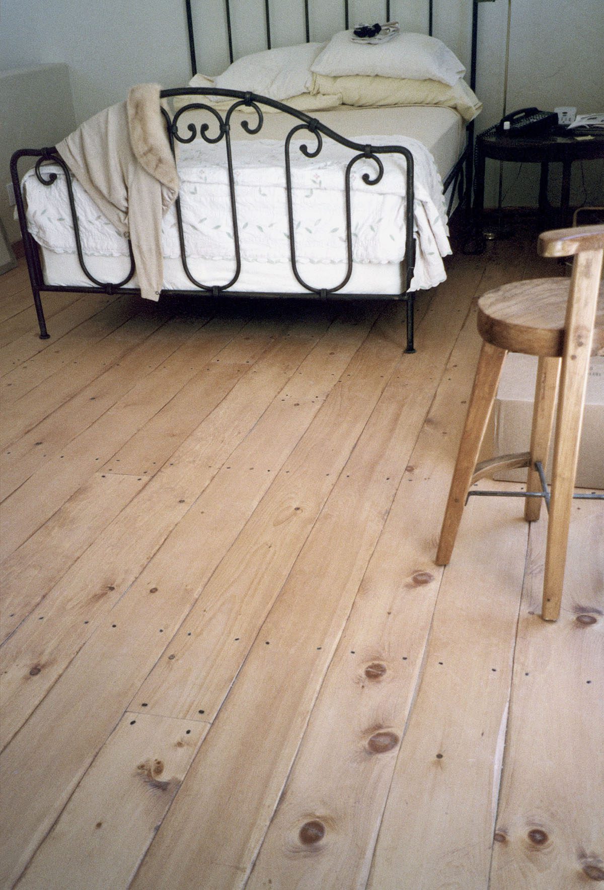 hand scraped edge flooring in bedroom