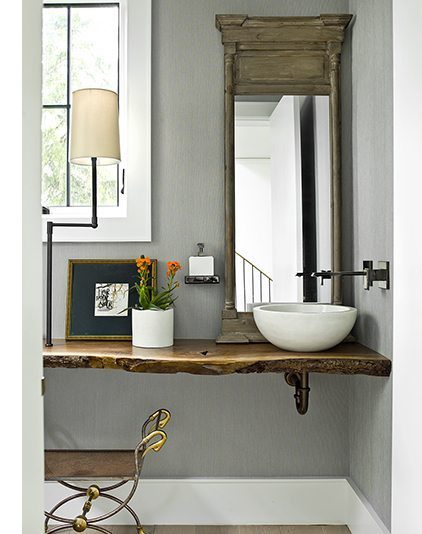 A farmhouse bathroom with natural edge counter