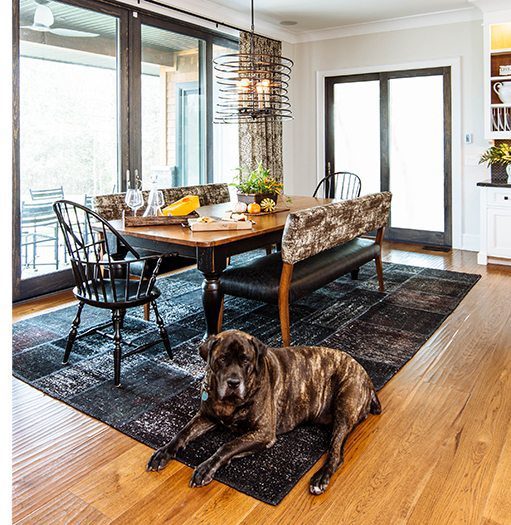 a large dog on lounging on hardwood flooring